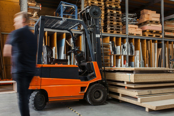 forklift lifting product pallets.