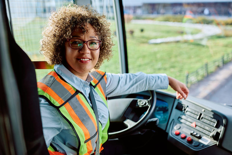 Happy female school bus driver