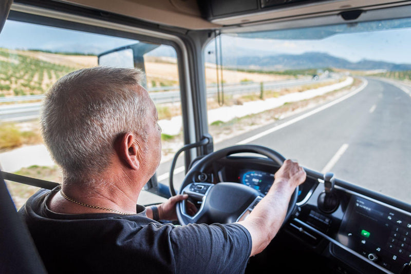 Older man driving a semi truck