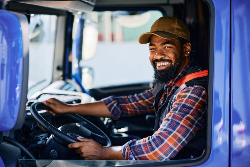 Truck driver sitting on an air ride seat
