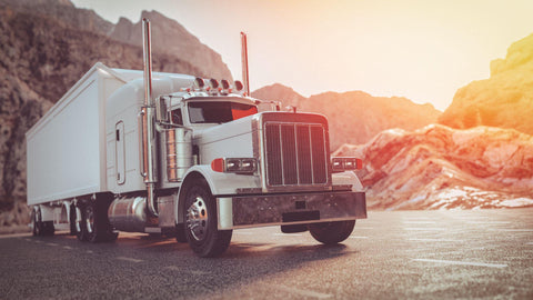 white big rig on the road