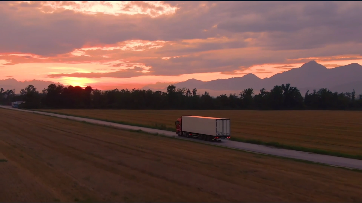 White Freight Truck Driving on Freeway